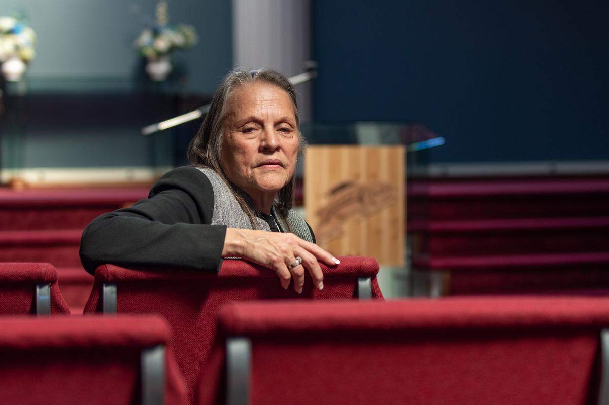 Sylvia Miller, vice chairwoman of the Puyallup Tribe of Indians, sits in the hall of the Tribe’s new funeral home in Tacoma. The Tribe purchased the property, formerly the Tacoma Christian Center, for $5.7 million in February. The funeral home was deeply needed, Miller said, as the Tribe has outgrown its previous space and is working to provide services once put on hold due to the COVID-19 pandemic.