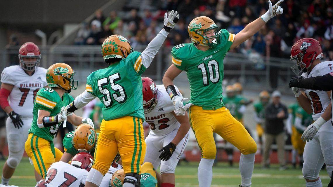 Tumwater defenders Max Henry (55) and Ryan Otton celebrate Gaven Murphy’s fumble recovery early in Saturday’s 2A state quarterfinal football game against Archbishop Murphy at Tumwater District Stadium on Nov. 23, 2019.