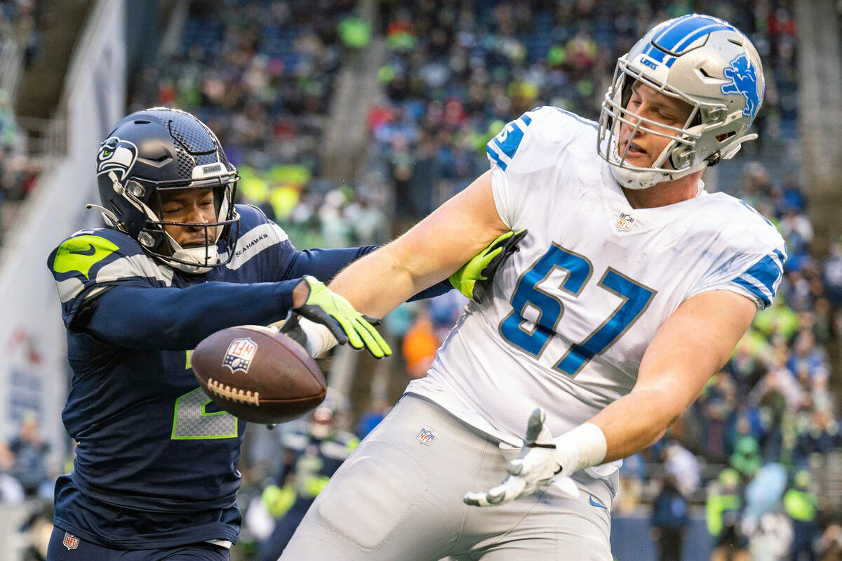 Seattle Seahawks cornerback D.J. Reed (2) knocks a pass away from Detroit Lions offensive tackle Matt Nelson (67) during the third quarter of an NFL game on Sunday, Jan. 2, 2022, at Lumen Field in Seattle.