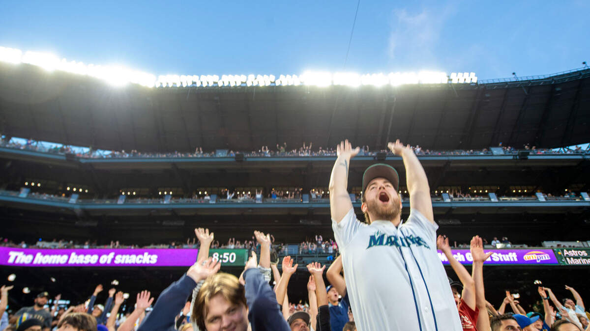 Fans participate in the wave during the Mariners game against the Houston Astros on Friday, July 22, 2022, at T-Mobile Park in Seattle.