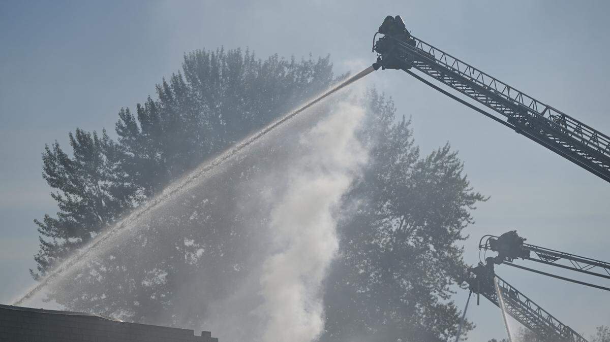 Pierce County fire crews work to douse the remains of a fire in this 2023 file photo.