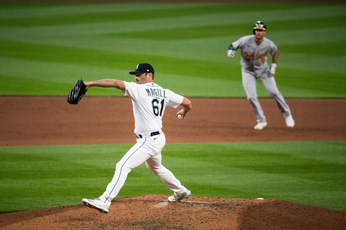 Mariner pitcher Matt Magill throws a pitch in the tenth inning. The Seattle Mariners played the Oakland Athletics in a Major League Baseball game at T-Mobile Park in Seattle, Wash., on Saturday, Aug. 1, 2020.