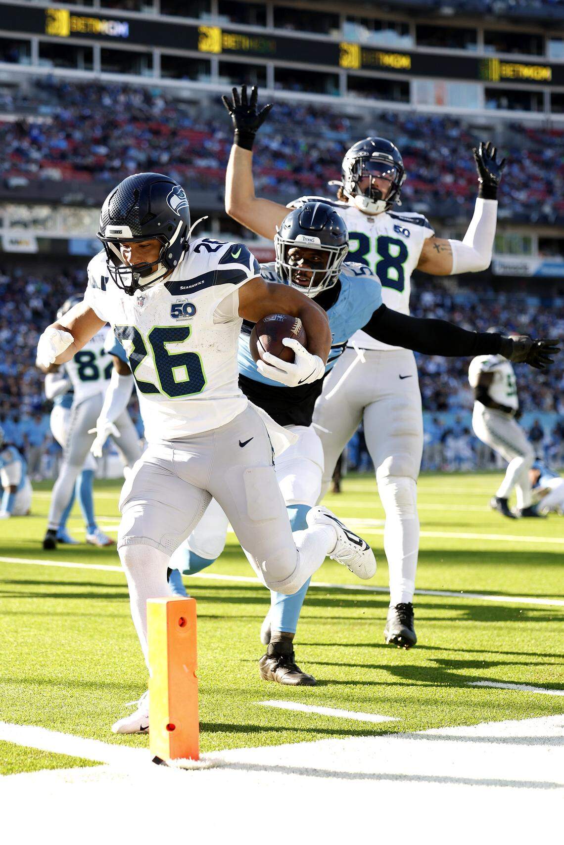 NASHVILLE, TENNESSEE - NOVEMBER 23: Zach Charbonnet #26 of the Seattle Seahawks runs into the end zone for a touchdown in the third quarter of the game against the Tennessee Titans at Nissan Stadium on November 23, 2025 in Nashville, Tennessee. (Photo by Wesley Hitt/Getty Images)
