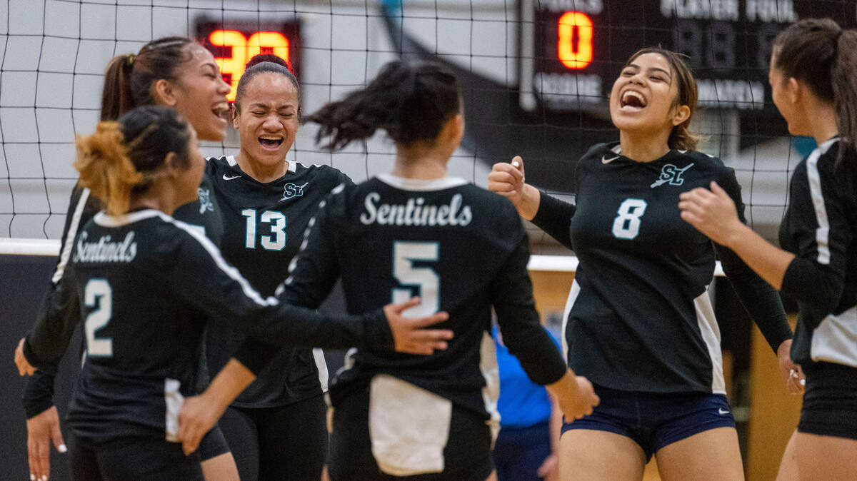 Spanaway Lake players celebrate after scoring a point in the first game of a 3A PCL match against Lincoln on Tuesday, Oct. 11, 2022, at Spanaway Lake High School.