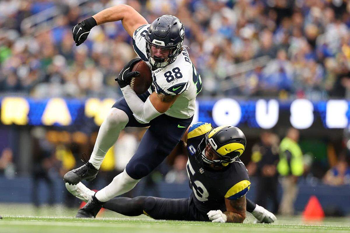 Seattle Seahawks tight end AJ Barner (88) avoids a tackle by Los Angeles Rams linebacker Nate Landman (53) during the second quarter at SoFi Stadium on November 16, 2025 in Inglewood, California. (Photo by Sean M. Haffey/Getty Images)
