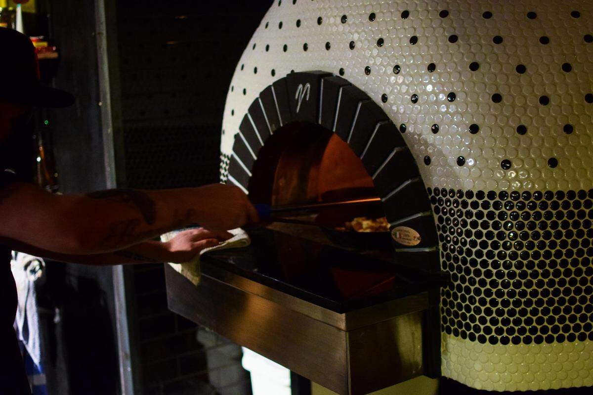 Bar Rosa opened in Tacoma’s Hilltop District in November 2021. With a Mugnaini wood-burning oven imported from Italy as its only cooking surface, the food focuses on Neapolitan pizzas accompanied by amaro-centric cocktails.