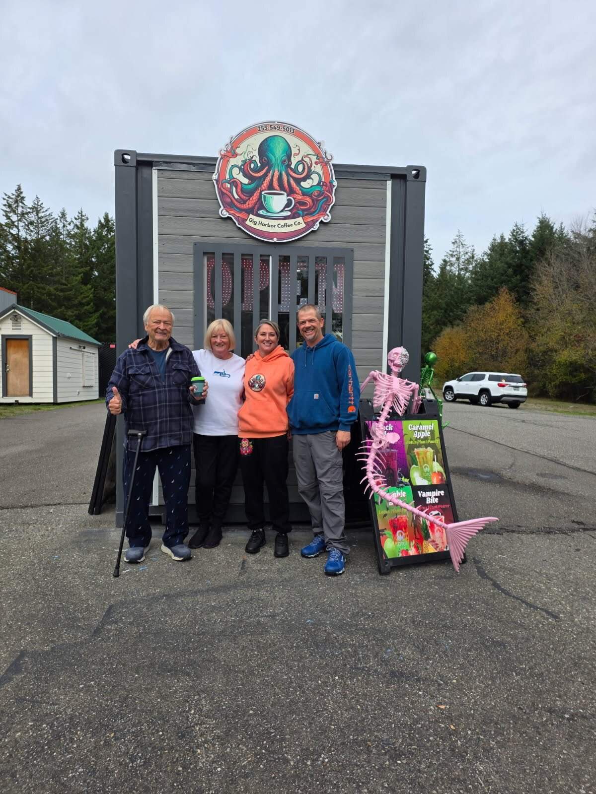 (Left to right) Gary Turnbull, Susan Turnbull, Tessa Turnbull and Jeremy Bilyeu stand in front of Gig Harbor Coffee Co., a new stand on the Key Peninsula that opened to business Monday, Oct. 20, 2025.