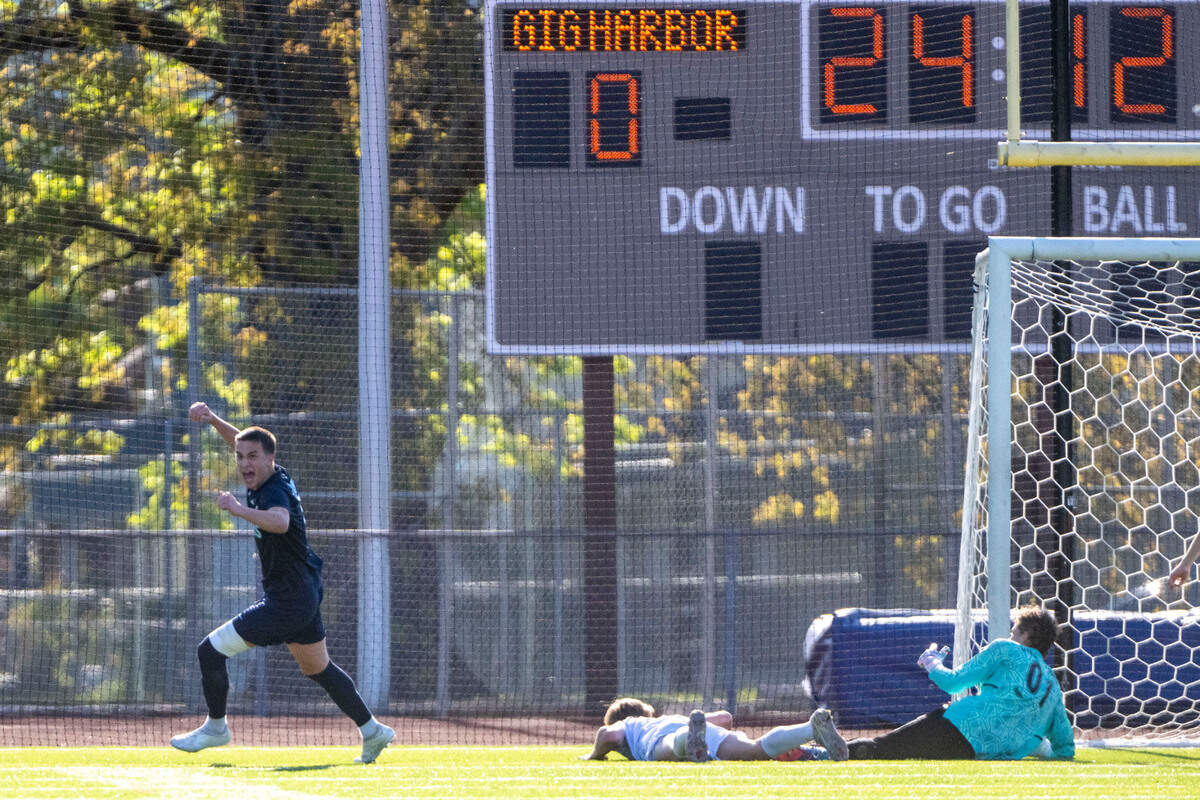 Gig Harbor forward Lucas Maharry celebrates after sliding the ball past Silas keeper Isaac Utrata-Foster for a goal in the first half of the 3A West Central/Southwest district soccer championship game on Thursday, May 11, 2023, at Sparks Stadium in Puyallaup, Wash.