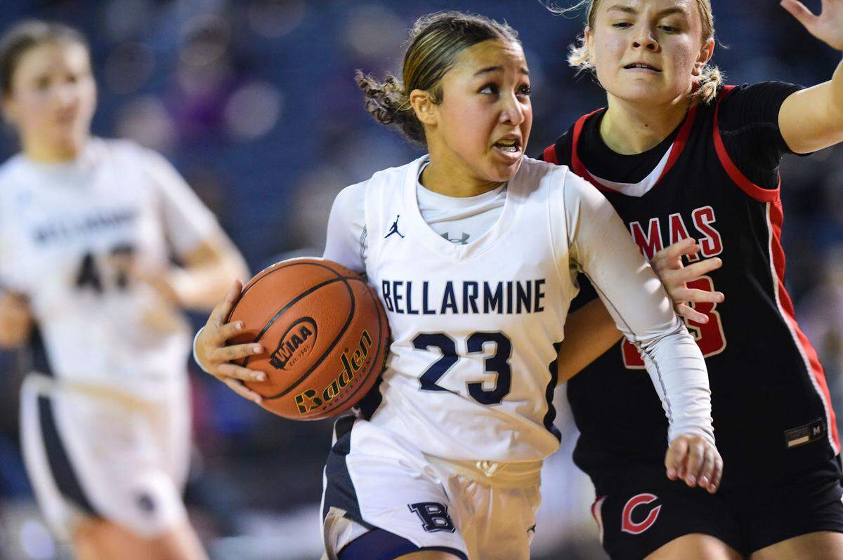 Bellarmine Prep guard Jada Travis (23) drives to the basket as Camas guard Riley Sanz (23) defends during the fourth quarter of a Class 4A state tournament game on Wednesday, March 2, 2022, at the Tacoma Dome, in Tacoma, Wash.
