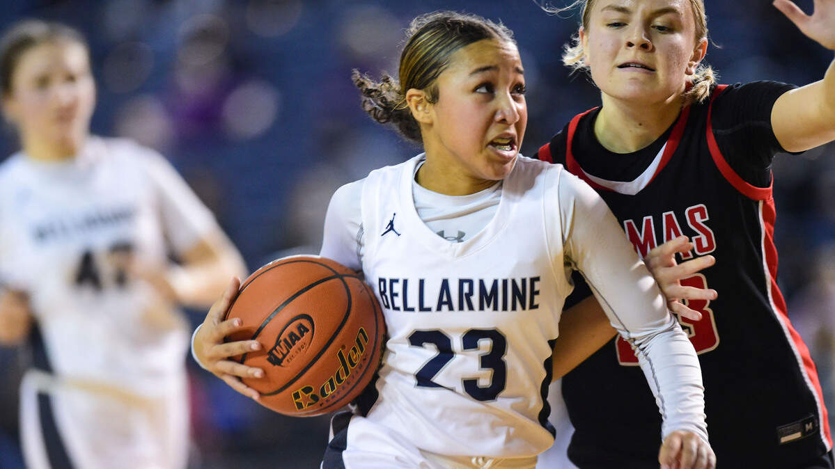 Bellarmine Prep guard Jada Travis (23) drives to the basket as Camas guard Riley Sanz (23) defends during the fourth quarter of a Class 4A state tournament game on Wednesday, March 2, 2022, at the Tacoma Dome, in Tacoma, Wash.