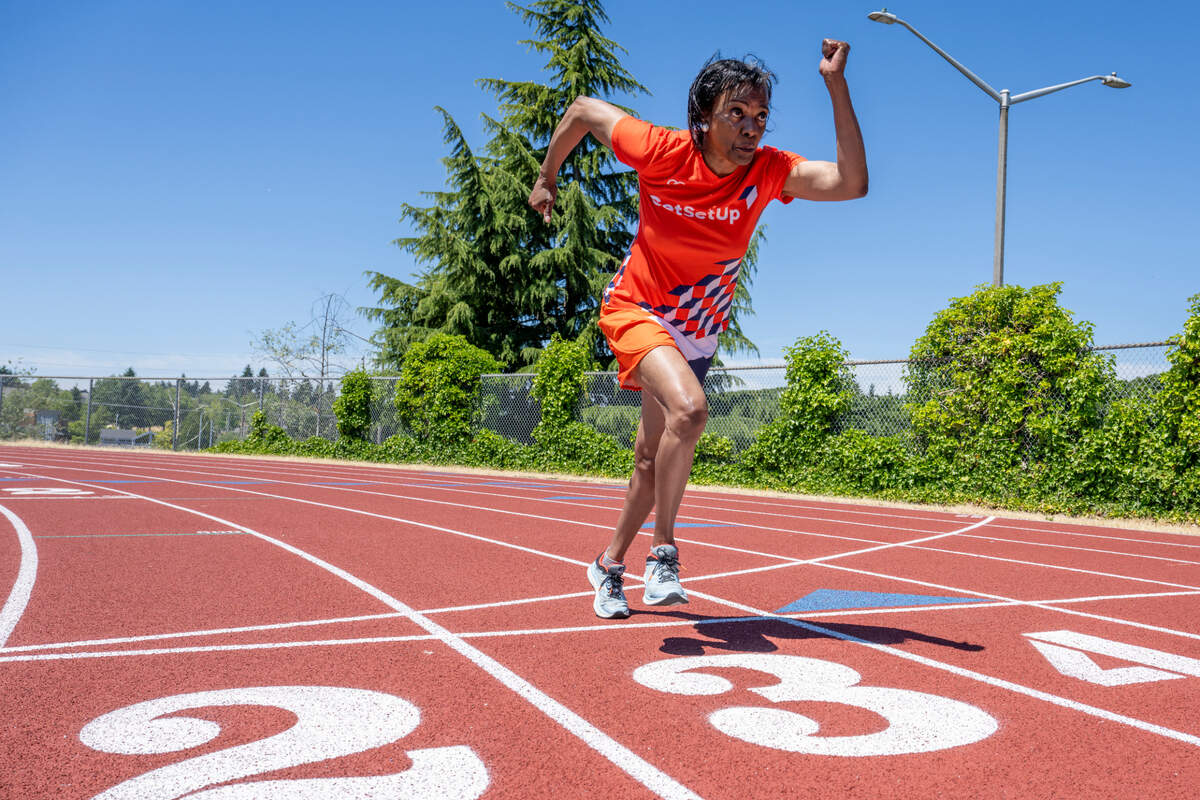 Madonna Hanna, a competitive sprinter in the National Senior Games, begins a sprint on the track at Truman Middle School on Tuesday, July 8, 2025, in Tacoma.