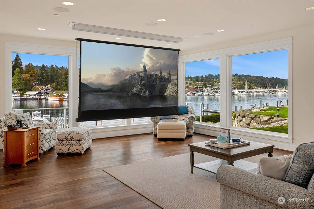 A drop-down movie screen offers families their own theater experience inside a $12.8 million home at 7906 Goodman Dr. NW in Gig Harbor, Wash.