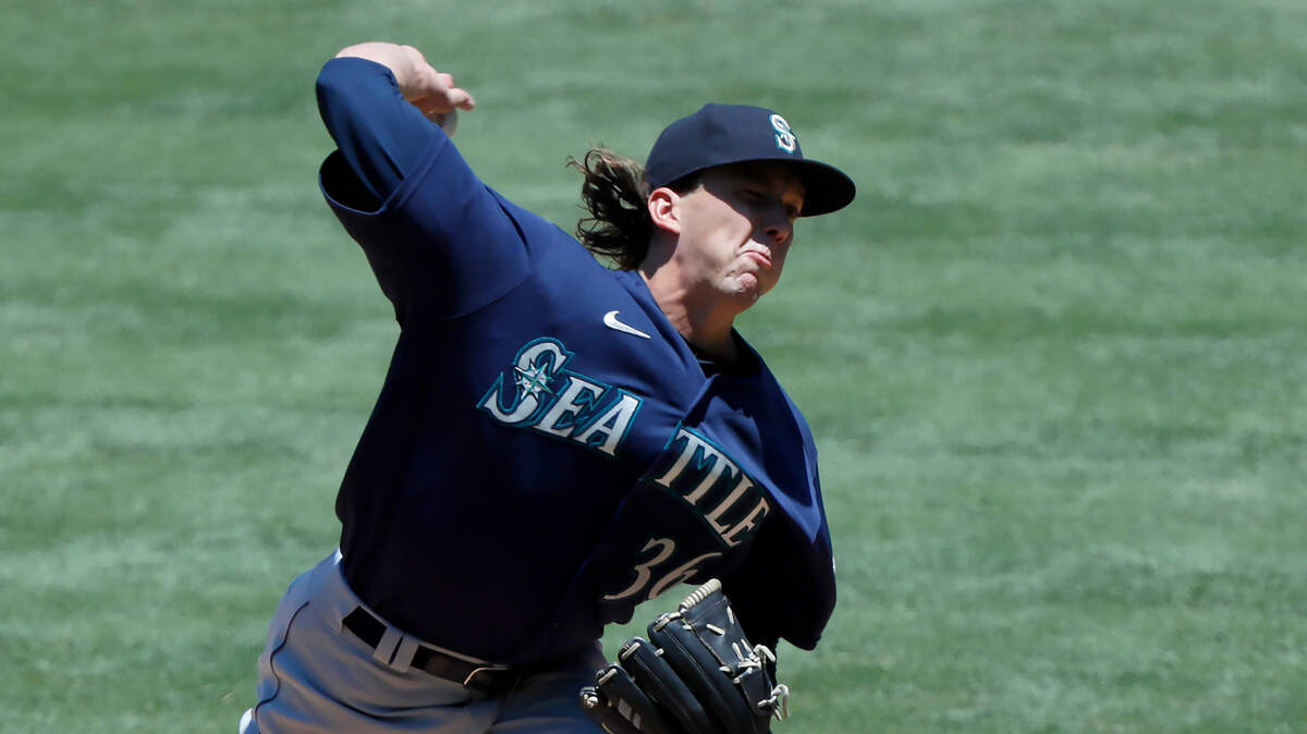 Seattle Mariners starting pitcher Logan Gilbert throws to a Los Angeles Angels batter during the first inning of a baseball game in Anaheim, Calif., Sunday, June 6, 2021. (AP Photo/Alex Gallardo)