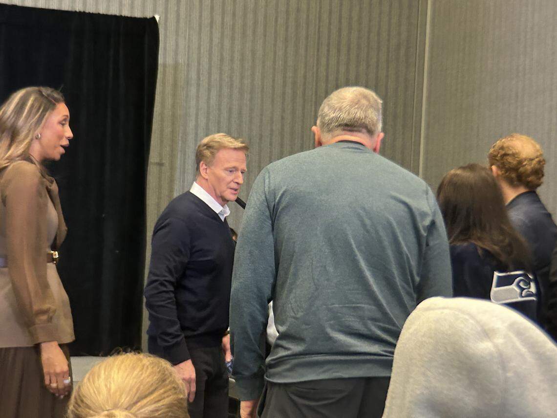 NFL commissioner Roger Goodell (left center) talking to Seahawks vice chair Bert Kolde (blue-gray sweater, center, back to camera) at Goodell’s annual state-of-the-NFL press conference at the Super Bowl, Monday, Feb. 2, 2026, at the San Jose Convention Center in San Jose, California.