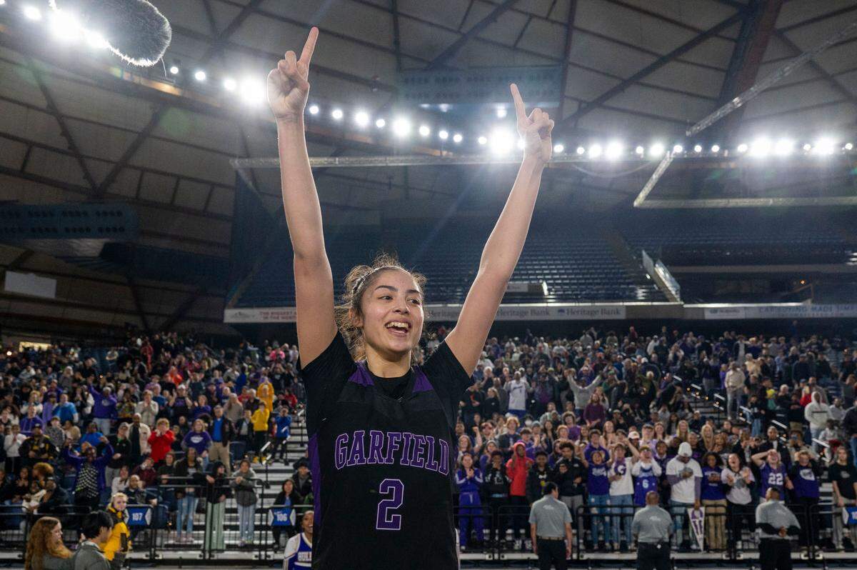 Garfield guard Katie Fiso (2) celebrates after the Bulldogs beat Lake Washington, 58-49, to win the Class 3A championship game on Saturday, March 4, 2023, in Tacoma, Wash.