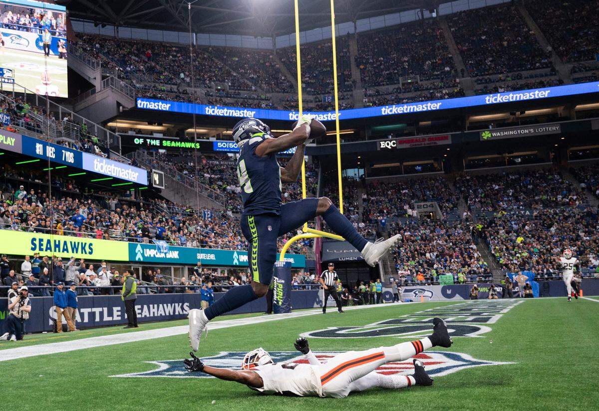 Seattle Seahawks wide receiver DK Metcalf (14) snags a touchdown over Cleveland Browns cornerback Justin Hardee Sr. (28) during the first quarterof the preseason game at Lumen Field, on Saturday, Aug. 24, 2024 in Seattle, Wash.