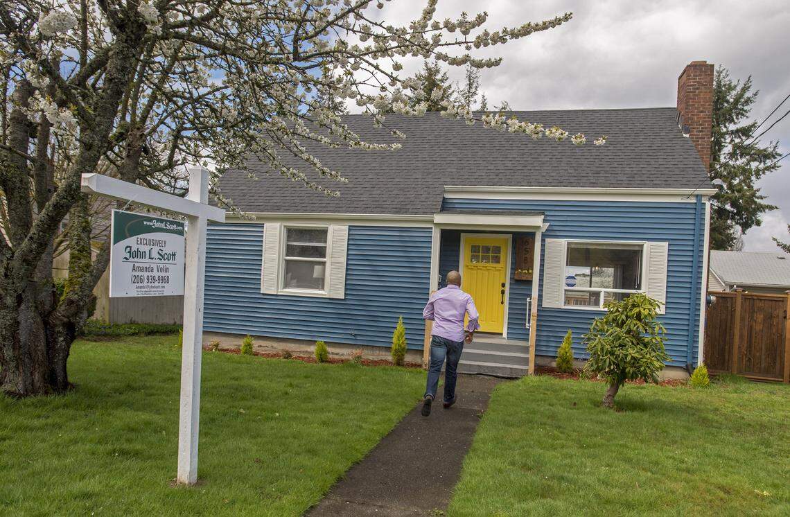 Real estate broker James Pitts III enters the the childhood home of serial murderer Ted Bundy in 2017. Washington state law does not require sellers to disclose if murders or other violent crimes occured on a property. 