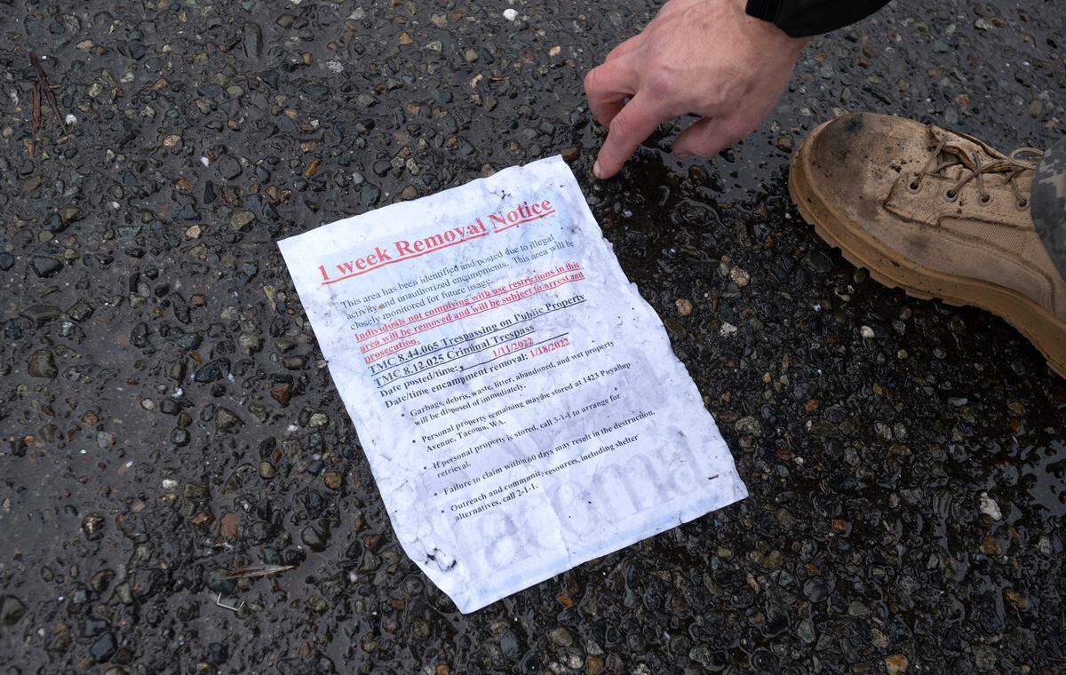 One-week removal notices were delivered to the G Street homeless encampment in Tacoma, Washington, on Tuesday, Jan. 11, 2022.
