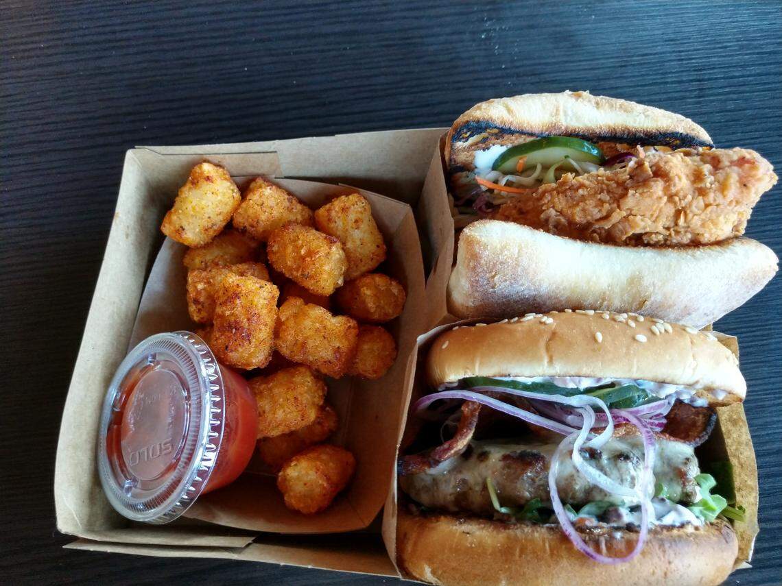 A Dixie fried chicken burger (upper right), Fat Stack burger and tots from Street Eats Mobile Eatery.