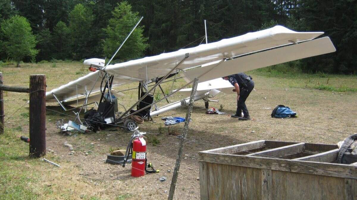 A Pierce County sheriff's deputy investigates a crashed ultralight Thursday afternoon near Burnett.