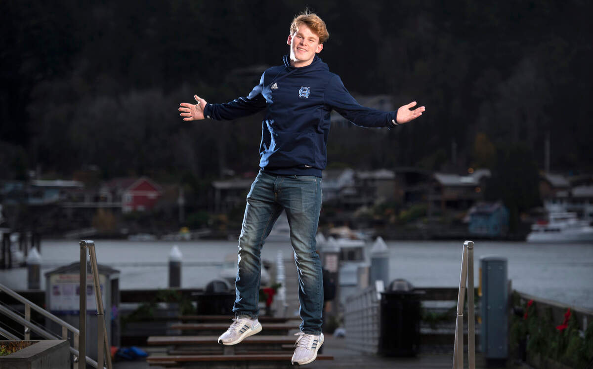 Gig Harbor High’s Cole Rushforth is the senior class president, all-league football player and TikTok celebrity with 2.1 million followers of his quirky informational posts. “I love weird stories, like strange, unusual stories,” he says. Rushforth is shown on the waterfront in Gig Harbor, Washington, on Tuesday, Nov. 30, 2021.