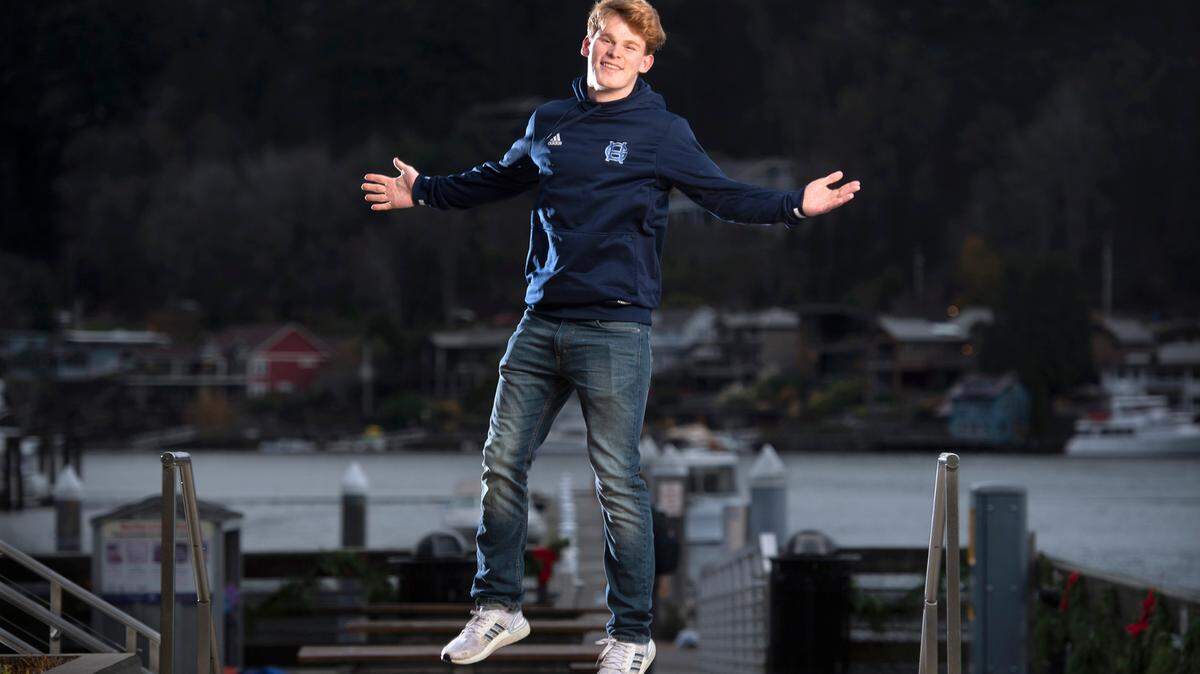 Gig Harbor High’s Cole Rushforth is the senior class president, all-league football player and TikTok celebrity with 2.1 million followers of his quirky informational posts. “I love weird stories, like strange, unusual stories,” he says. Rushforth is shown on the waterfront in Gig Harbor, Washington, on Tuesday, Nov. 30, 2021.