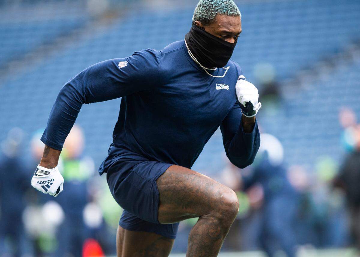 Seattle Seahawks wide receiver DK Metcalf (14) warms up before the start of an NFL game against the California Panthers at Lumen Field in Seattle Wash., on Dec. 11, 2022.
