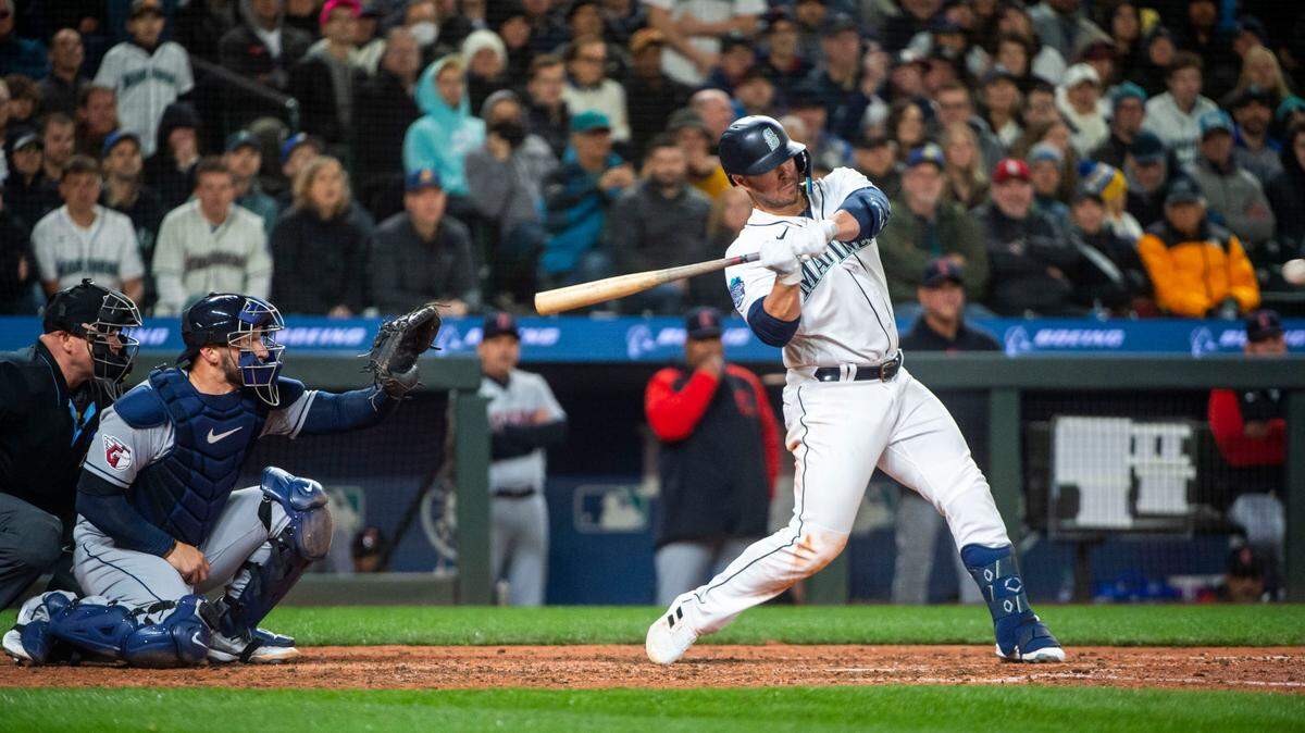Seattle Mariners first baseman Ty France (23) hits a homer during the eighth inning of the Mariners home opener against the Cleveland Guardians at T-Mobile Park in Seattle on Thursday, March 30, 2023. Mariners won 3-0.