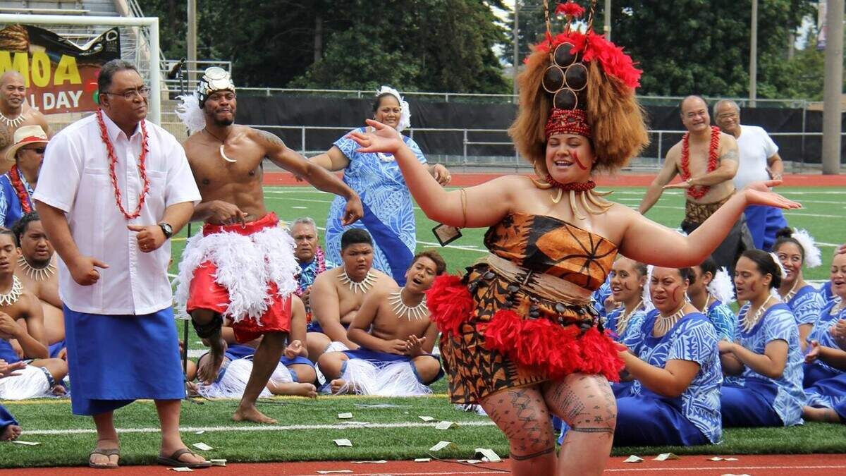 Faith Taifalioaana Ale performs the Taualuga, a traditional Samoan dance, while wearing cultural attire at the Harry E. Lang Stadium in Lakewood, Washington, during the 7th Annual Samoa Cultural Week in 2016. The festival returns this year after a pause for the pandemic.
