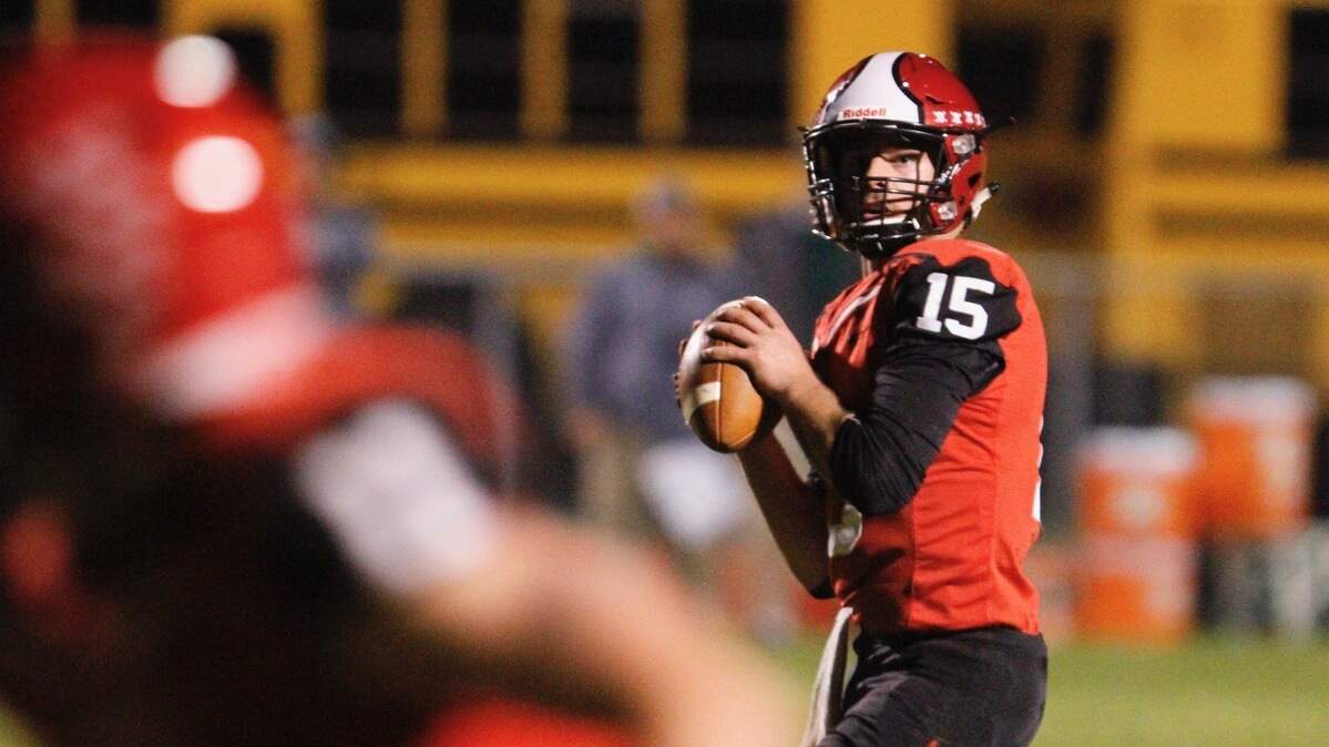 Yelm quarterback Kyle Robinson surveys the field in Yelm’s 42-21 win over Peninsula on Friday, Oct. 12, 2018 at Yelm High School.
