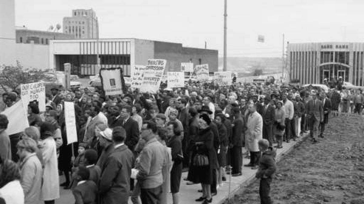 About 1,000 marchers paid tribute to the memory of slain civil rights leader Martin Luther King Jr. with a silent march that led to the steps of the County-City Building on April 7, 1968. King had been assassinated in Memphis three days before.