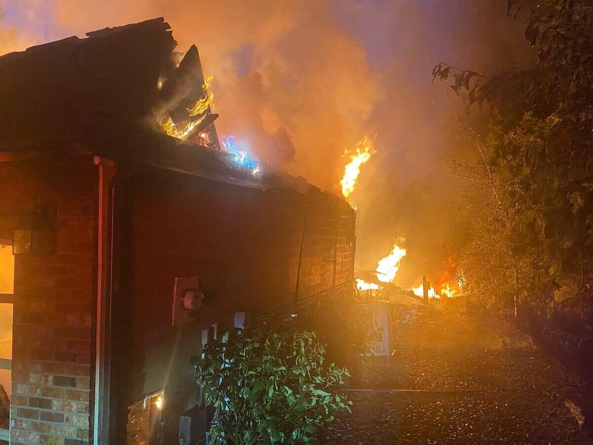 A home was fully engulfed in flames July 29, 2023 on the 21100 block of Snag Island Drive E.