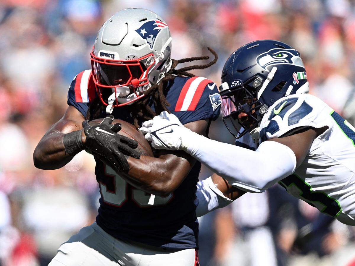 Sep 15, 2024; Foxborough, Massachusetts, USA; Seattle Seahawks linebacker Boye Mafe (53) tackles New England Patriots running back JaMycal Hasty (39) during the first half at Gillette Stadium. Mandatory Credit: Brian Fluharty-Imagn Images