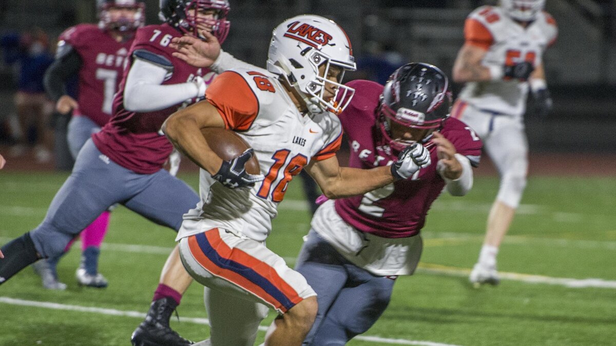 Philip Riley of Lakes runs back an intercepetion in a football game at Art Crate Field in Spanaway, October 4, 2018.  Lakes beat Bethel handily.