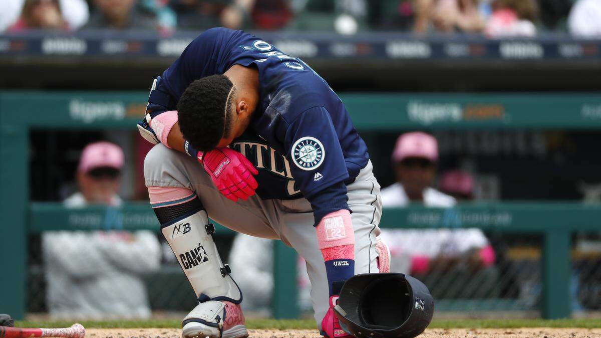 Seattle Mariners' Robinson Cano (22) reacts after being hit on the hand by a Detroit Tigers relief pitcher Blaine Hardy pitch in the third inning of a baseball game in Detroit, Sunday, May 13, 2018. (AP Photo/Paul Sancya)