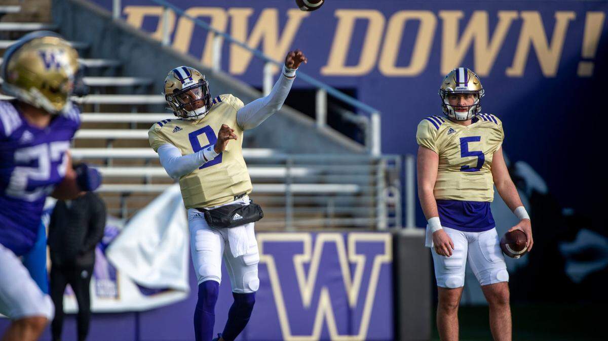 Washington quarterback Michael Penix, Jr. attempts a pass during spring practice on Friday, April 8, 2022, at Husky Stadium in Seattle.