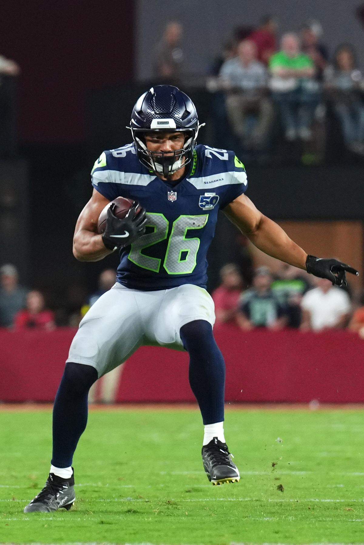 Seattle Seahawks running back Zach Charbonnet (26) runs against the Arizona Cardinals in the second quarter at State Farm Stadium. Mandatory Credit: Joe Camporeale-Imagn Images