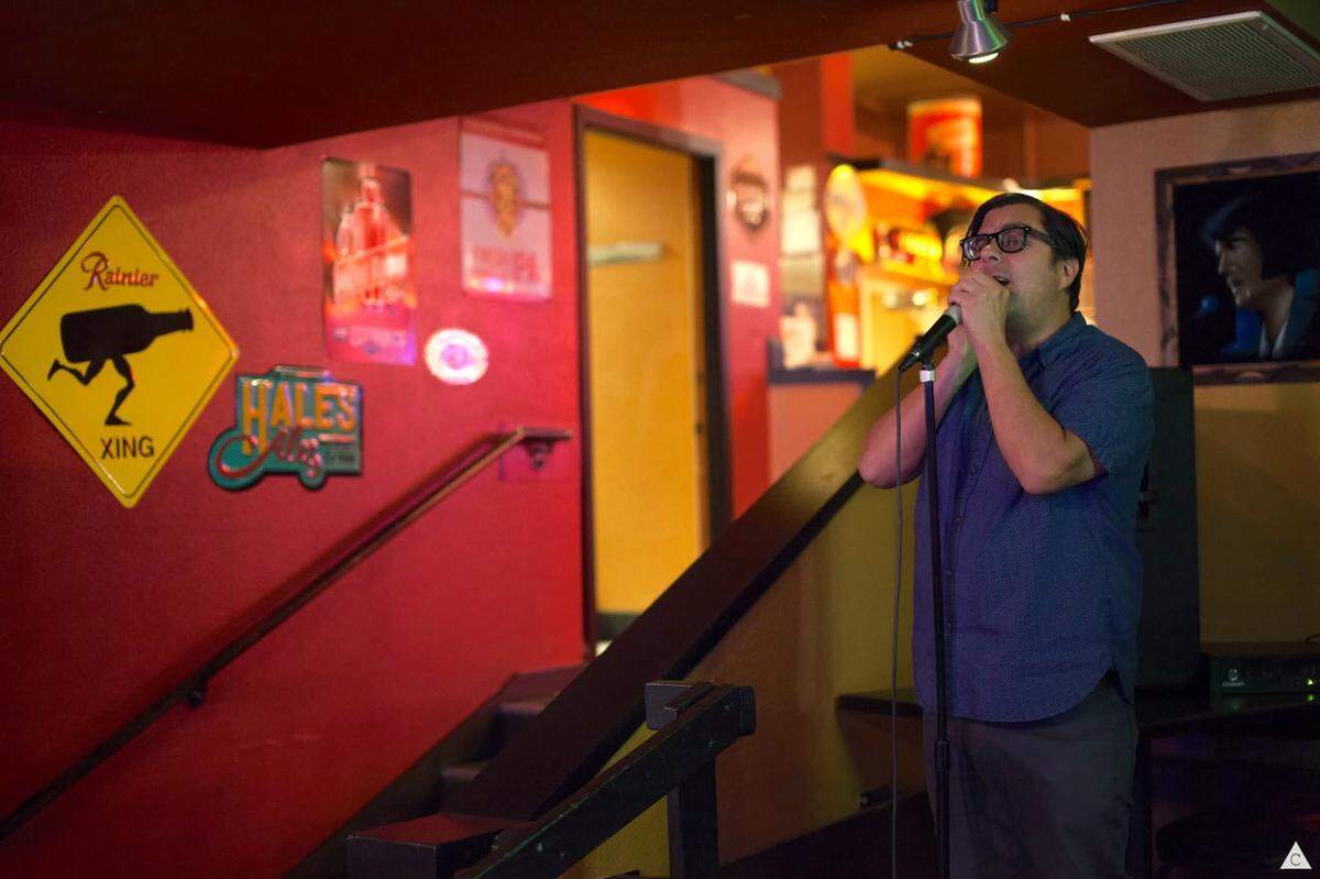 A customer sings karaoke at Puget Sound Pizza in Tacoma.
