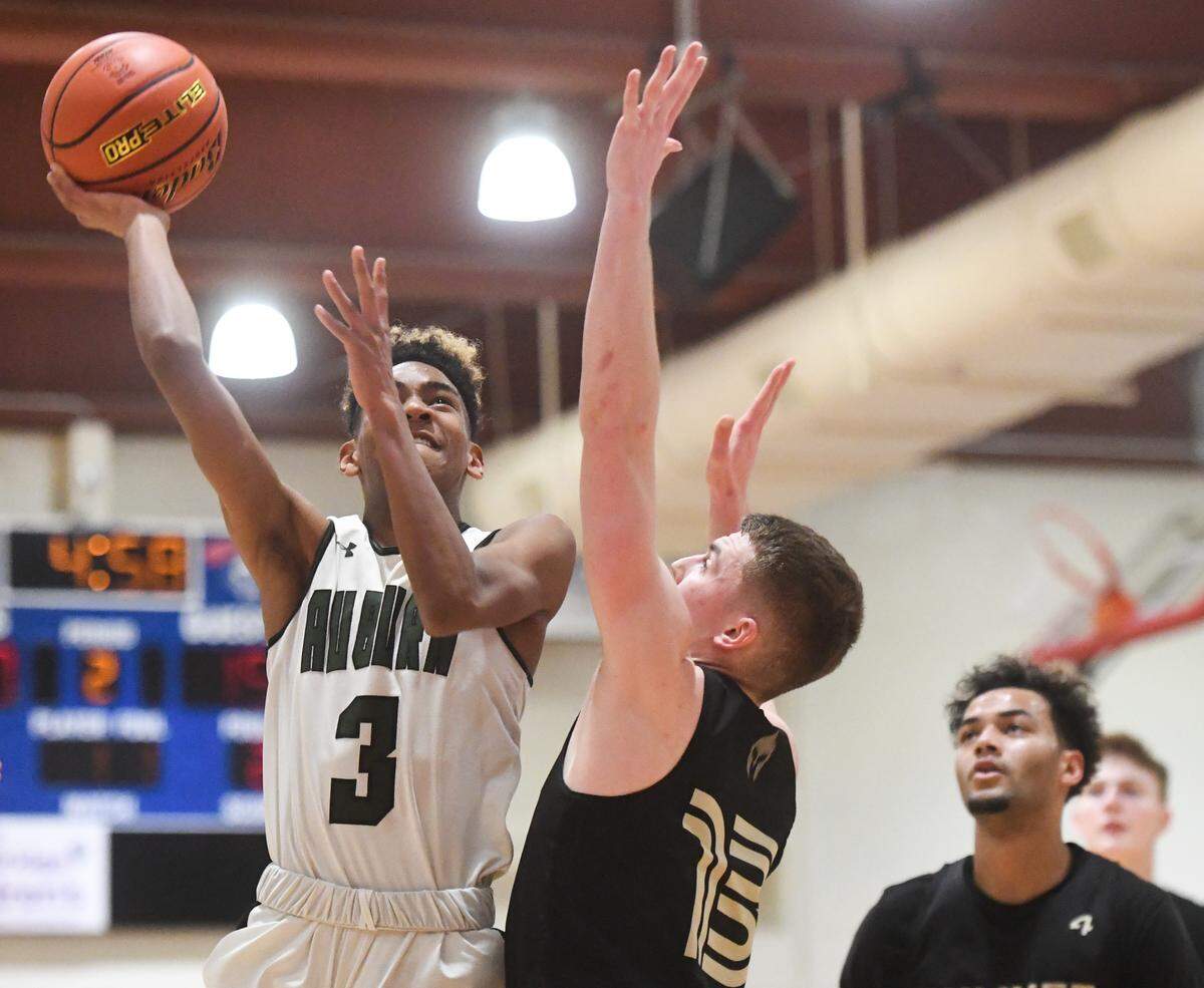 Auburn’s Amar Rivers shoots during the second quarter. Sumner played Auburn in a basketball game at Wilson High School in Tacoma, Wash., on Friday, Feb. 14, 2020.