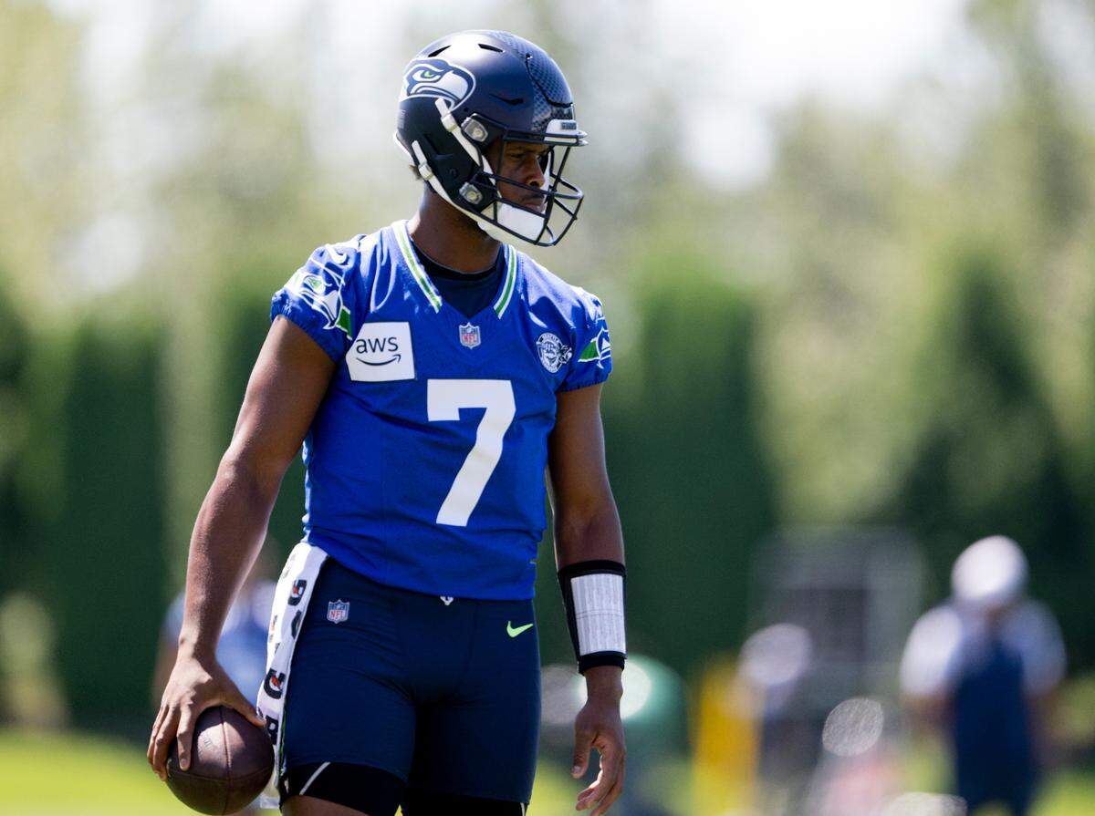 Seattle Seahawks quarterback Geno Smith (7) warms up during the first day of training camp at the Virginia Mason Athletic Center, on Wednesday, July 24, 2024, in Renton.