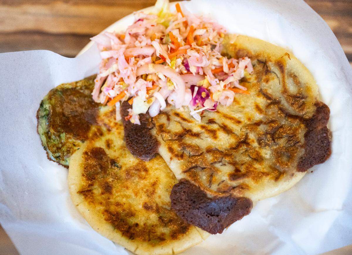 Amaya discovered the secret to great pupusas by closing her eyes. “See with your hands,” she now teaches her cooks at both restaurants. Served with curtido, a spicy pickled slaw, Balcon’s pupusas boast delightful burnt-ends thanks to generous fillings.