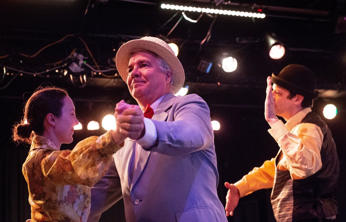 From left: Brianna Lobbet, playing Marian, Dan Englehard, playing Professor Harold Hill, and Eli Ghorley playing Marcellus, dance onstage during a rehearsal for The Music Man at Paradise Theater in Gig Harbor, Wash., on Thursday, May 31, 2018.