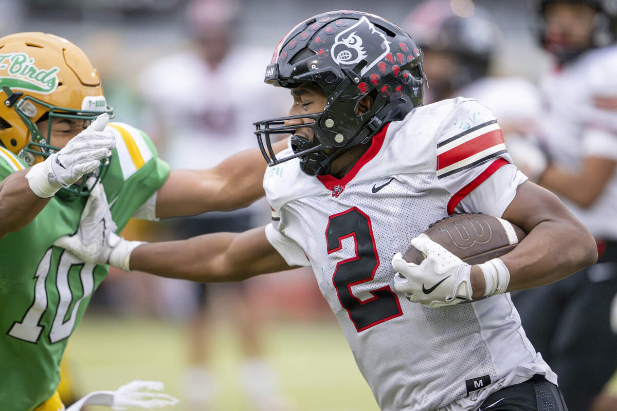 Tumwater defensive back Tyler Briscoe (10) reaches out in an attempt to tackle Franklin Pierce running back Bryson Allen (2) on Saturday, Nov. 22, 2025, in Tumwater, Wash.