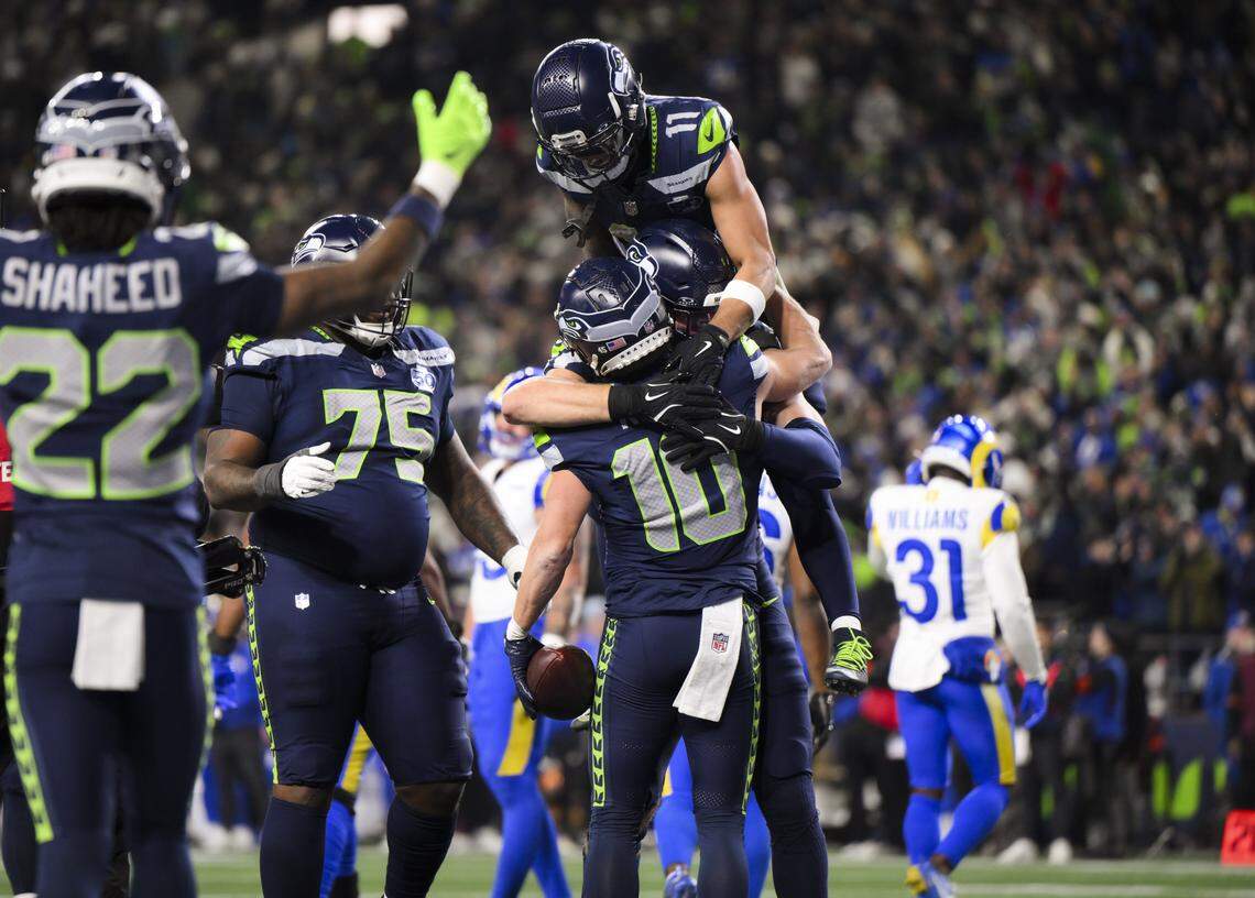 Seattle Seahawks wide receiver Cooper Kupp (10) celebrates his touchdown with teammates during the third quarter of the NFC Championship game against the Los Angeles Rams at Lumen Field, on Sunday, Jan. 25, 2026, in Seattle.