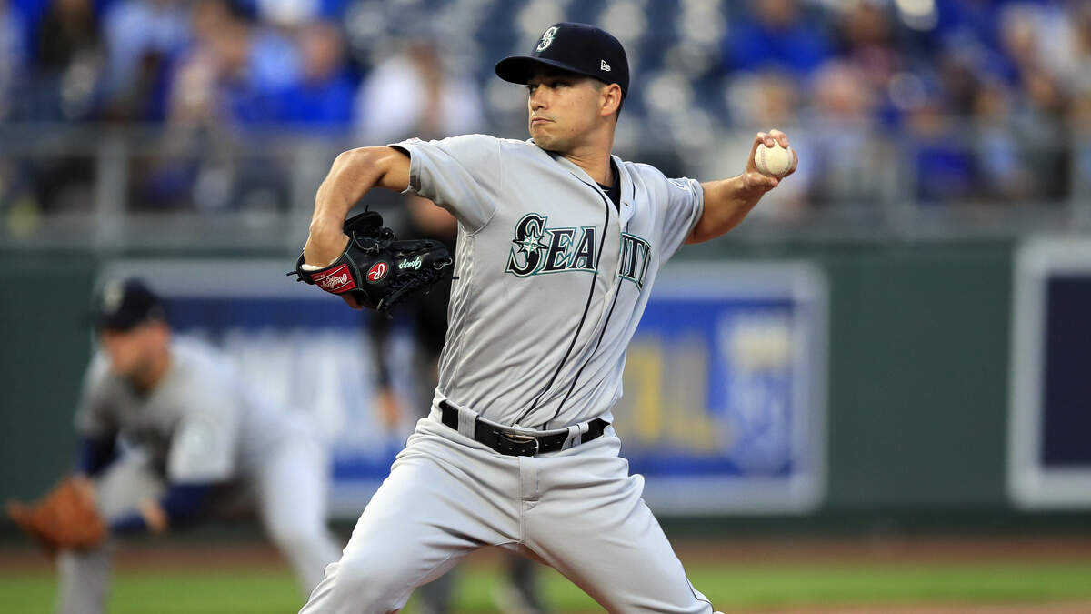Seattle Mariners starting pitcher Marco Gonzales delivers to a Kansas City Royals batter during the first inning of a baseball game at Kauffman Stadium in Kansas City, Mo., Tuesday, April 9, 2019. (AP Photo/Orlin Wagner)