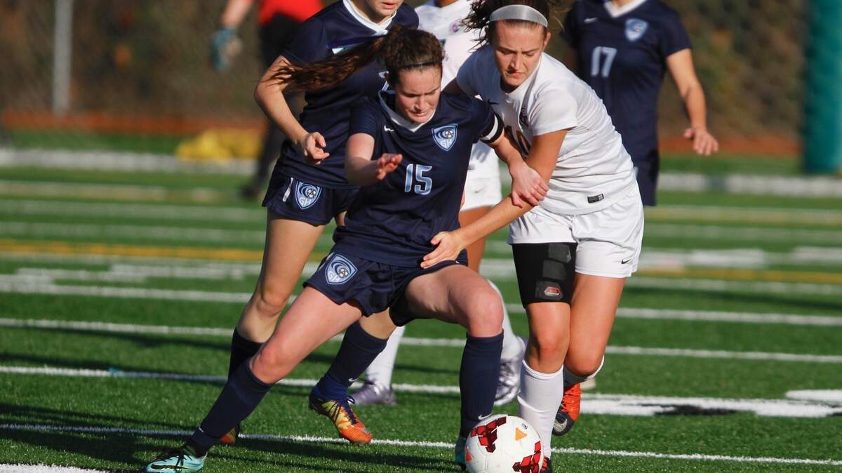 Gig Harbor senior Anna Stewart fights for posession in Gig Harbor’s Class 3A state tournament quarterfinal match against Edmonds-Woodway on Saturday, Nov. 10, 2018 at Roy Anderson Field.