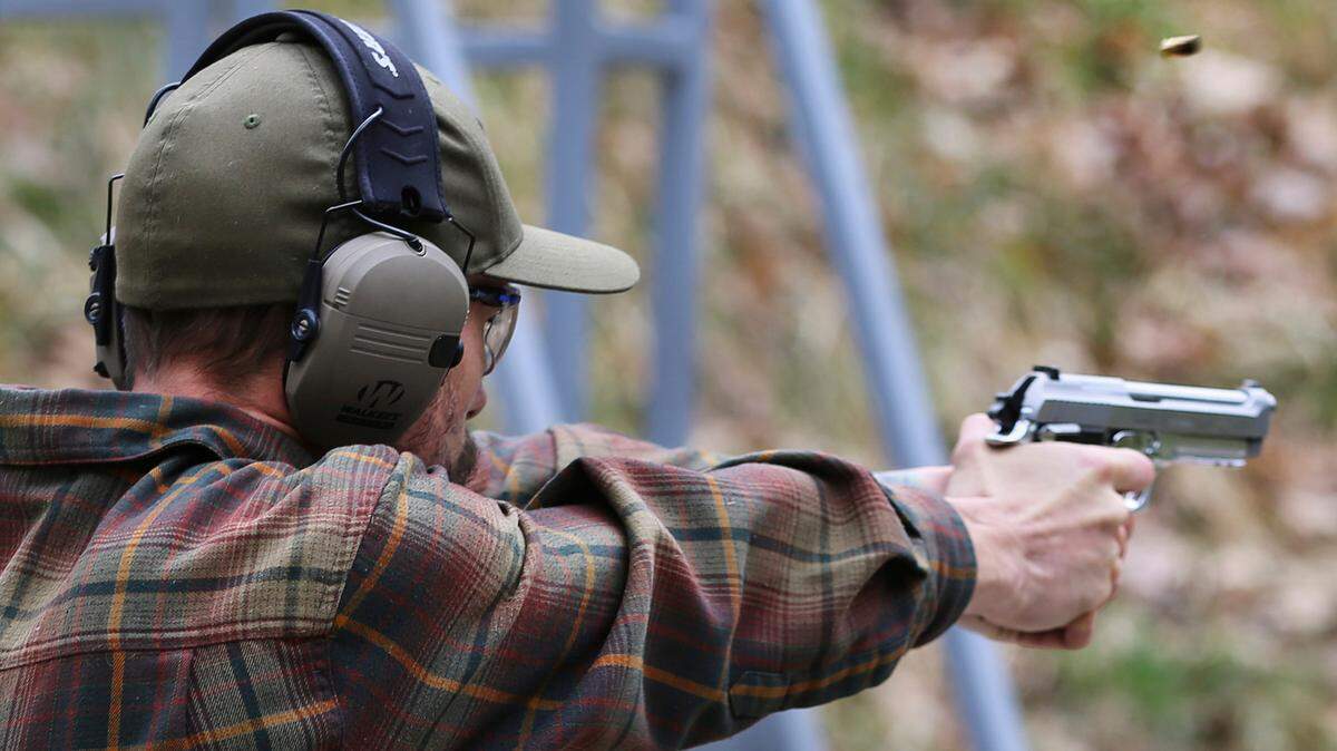 A shooter fires a handgun at a target at Slate Ridge Vermont, an un-permitted gun range and firearms training center owned by Daniel Banyai, Saturday April 17, 2021 in West Pawlet, Vt., during what organizers called a Second Amendment Day Picnic. (AP Photo/Wilson Ring, File)