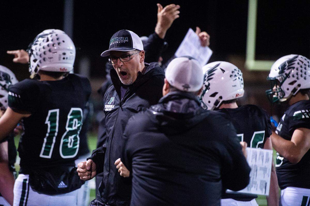 Peninsula’s Head Coach Ross Filkins is fired up after a game-sealing fumble recovery in the fourth quarter. Peninsula played Yelm in a football game at Roy Anderson Field in Purdy, Wash., on Friday, Oct. 18, 2019.