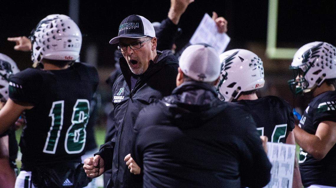 Peninsula’s Head Coach Ross Filkins is fired up after a game-sealing fumble recovery in the fourth quarter. Peninsula played Yelm in a football game at Roy Anderson Field in Purdy, Wash., on Friday, Oct. 18, 2019.