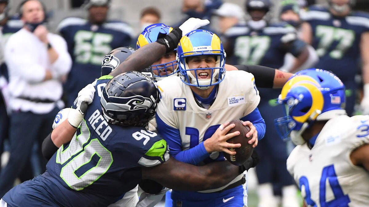Los Angeles Rams quarterback Jared Goff (16) is sacked in the first quarter. The Seahawks played the Rams in a wild-card game on Saturday, Jan. 9, 2021 at Lumen Field in Seattle, Wash.